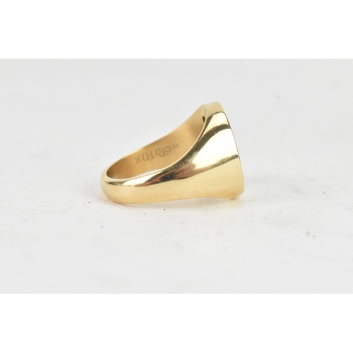 41 - A modern three stone diamond 10k yellow gold signet ring, engraved monogram letter 'M' and three ver... 
