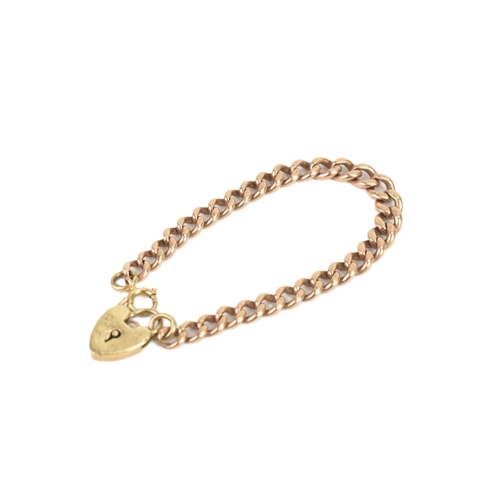 44 - A 9ct rose gold child's curb link bracelet, having a later 9ct yellow gold heart shaped padlock clas... 