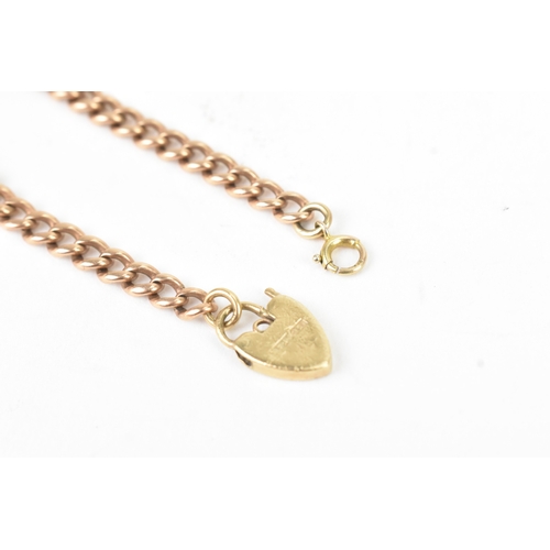 44 - A 9ct rose gold child's curb link bracelet, having a later 9ct yellow gold heart shaped padlock clas... 