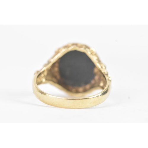 47 - A 9ct yellow gold signet ring, set with oval cut bloodstone intaglio, engraved with female profile, ... 