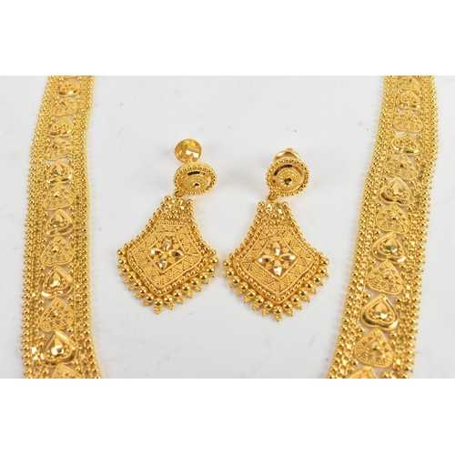 5 - A yellow gold filigree necklace and matching pair of drop earrings, testing as 20-22ct gold, the nec... 