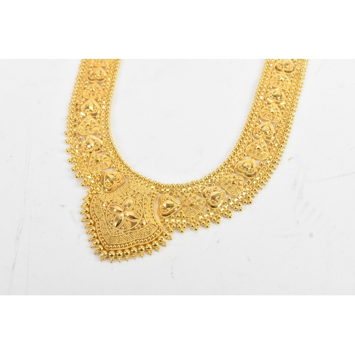 5 - A yellow gold filigree necklace and matching pair of drop earrings, testing as 20-22ct gold, the nec... 