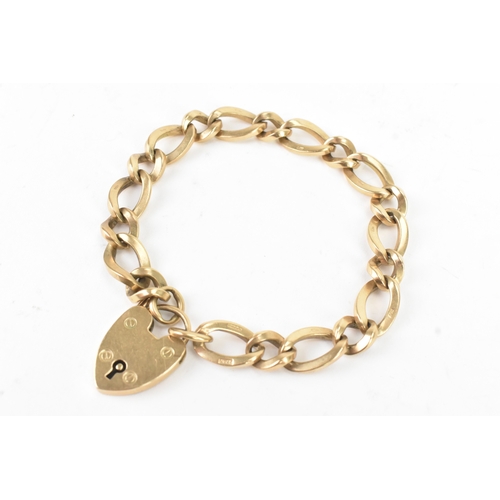 50 - A 9ct yellow gold curb link bracelet with a heart shaped padlock clasp, stamped 375, with British ha... 