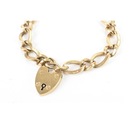 50 - A 9ct yellow gold curb link bracelet with a heart shaped padlock clasp, stamped 375, with British ha... 