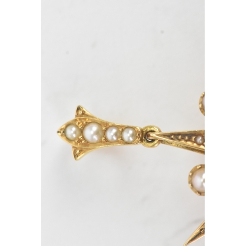 51 - A Victorian celestial pearl and yellow metal starburst brooch/pendant tested as 18ct gold, features ... 