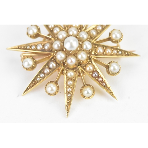 51 - A Victorian celestial pearl and yellow metal starburst brooch/pendant tested as 18ct gold, features ... 
