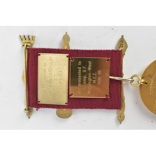 52 - A 9ct yellow gold Masonic Jewel the ribbon-mounted suspension with crossed sceptres, helmet and blue... 