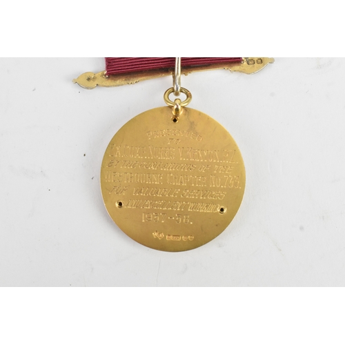52 - A 9ct yellow gold Masonic Jewel the ribbon-mounted suspension with crossed sceptres, helmet and blue... 
