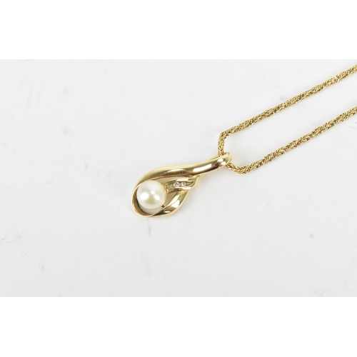 54 - A pearl and diamond 14ct yellow gold pendant, on an 18ct yellow gold herringbone woven link necklace... 