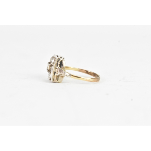 56 - A Victorian diamond cluster ring featuring five old cut diamonds, arranged in a geometric design, wi... 