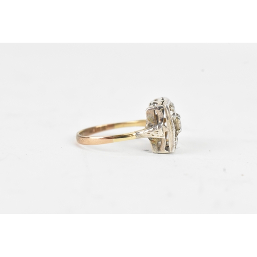 56 - A Victorian diamond cluster ring featuring five old cut diamonds, arranged in a geometric design, wi... 