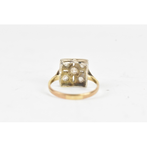 56 - A Victorian diamond cluster ring featuring five old cut diamonds, arranged in a geometric design, wi... 