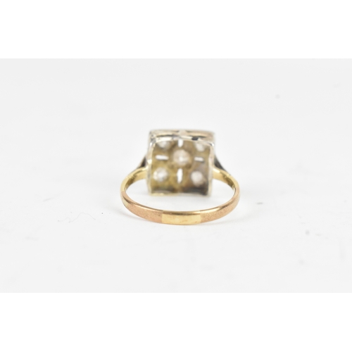 56 - A Victorian diamond cluster ring featuring five old cut diamonds, arranged in a geometric design, wi... 
