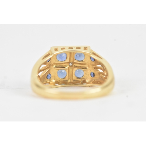 57 - A modern blue sapphire and diamond 14ct yellow and white gold cluster ring, featuring four round cut... 