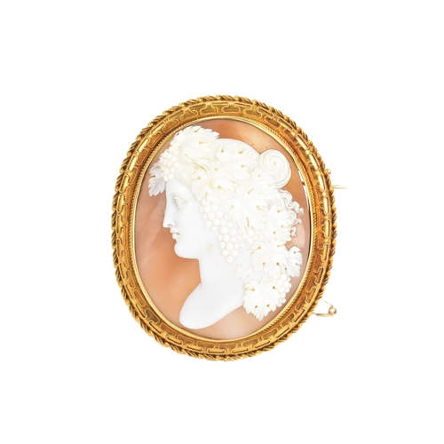 8 - A Victorian yellow gold shell cameo brooch, unmarked, carved in relief depicting a classical female ... 
