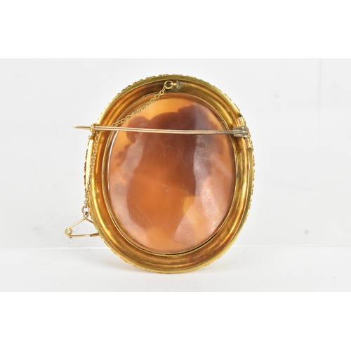 8 - A Victorian yellow gold shell cameo brooch, unmarked, carved in relief depicting a classical female ... 