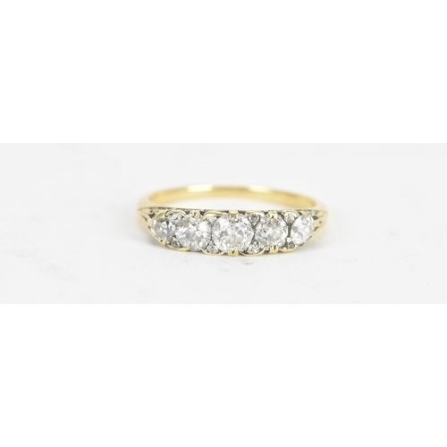 14 - A late 19th/early 20th century diamond yellow gold engagement ring, unmarked, set with five graduate... 