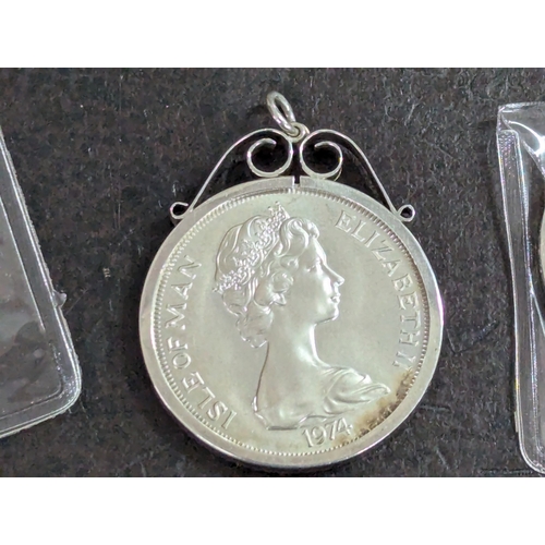 36 - Mixed British coinage to include a 1974 silver Isle of Man crown, mounted in a silver pendant frame,... 