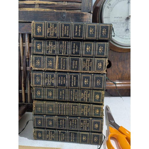 39 - A mixed group to include an oak wall hanging barometer, books to include The Historians History of t... 