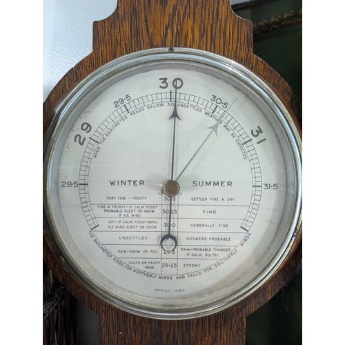 39 - A mixed group to include an oak wall hanging barometer, books to include The Historians History of t... 