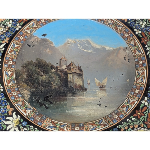 43 - A Swiss Thoune ceramic souvenir Majolica charger, with hand painted lake scene to the centre, 40.5cm... 