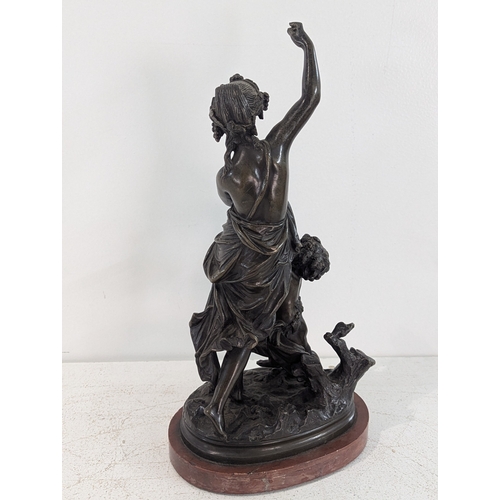 45 - A European bronze Bacchante and Putto sculpture on marble base, 36.5cmH
Location: R2.1
If there is n... 