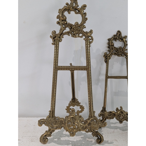 47 - Three ornate brass table easels and a silver plated bottle coaster
Location: R1.2
If there is no con... 