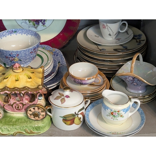 51 - A large mixed group of ceramics to include a set of three horse and carriage figural groups, Noritak... 