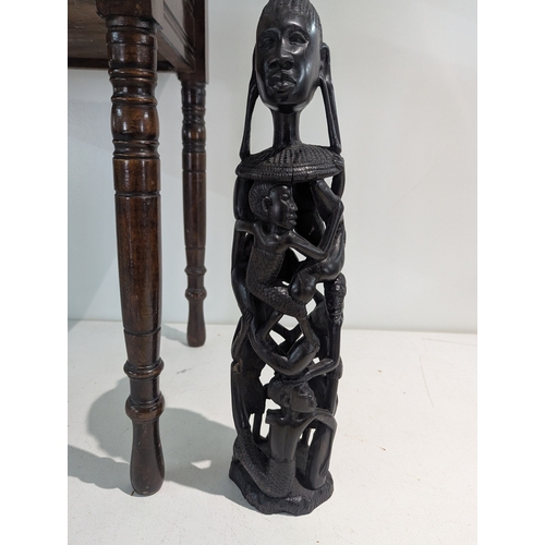 56 - A late Victorian mahogany piano stool, together with an ebony treen figural group
Location: RAB
If t... 