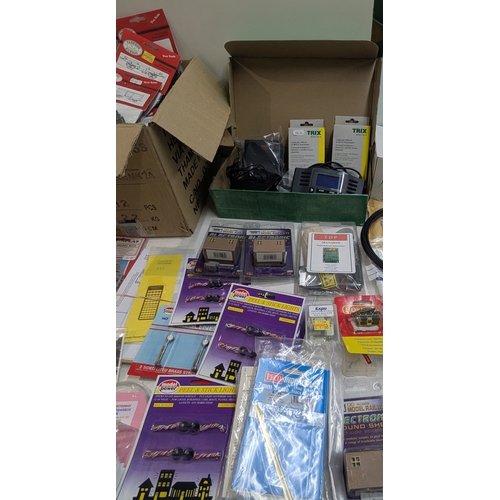 60 - A large collection of 00/HO gauge model railway hobby accessories, kits, parts, mainly by Hornby, ma... 