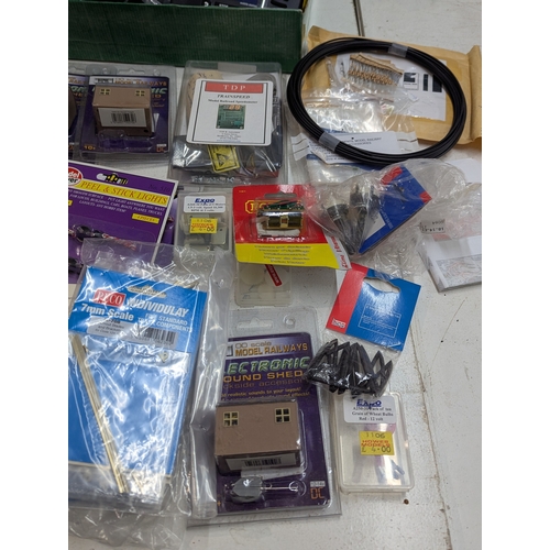 60 - A large collection of 00/HO gauge model railway hobby accessories, kits, parts, mainly by Hornby, ma... 