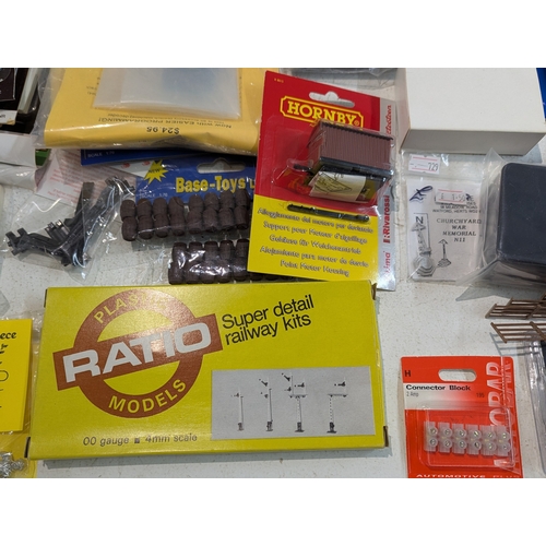 60 - A large collection of 00/HO gauge model railway hobby accessories, kits, parts, mainly by Hornby, ma... 
