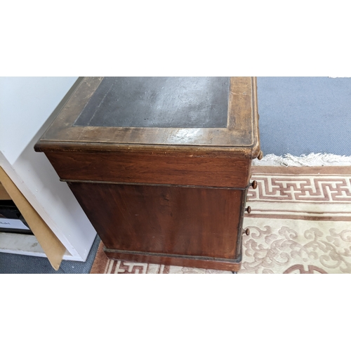 3 - A Victorian walnut twin pedestal desk having a leather topped scriber and nine drawers, 70.5h and 11... 