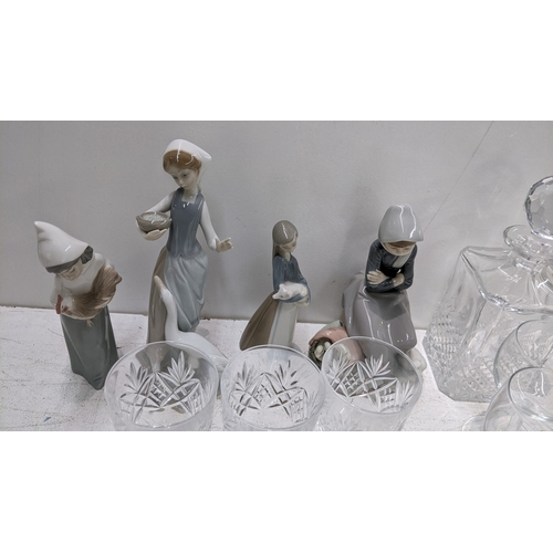 30 - Four Lladro figures together with a selection of glassware 
Location: LAF
If there is no condition r... 
