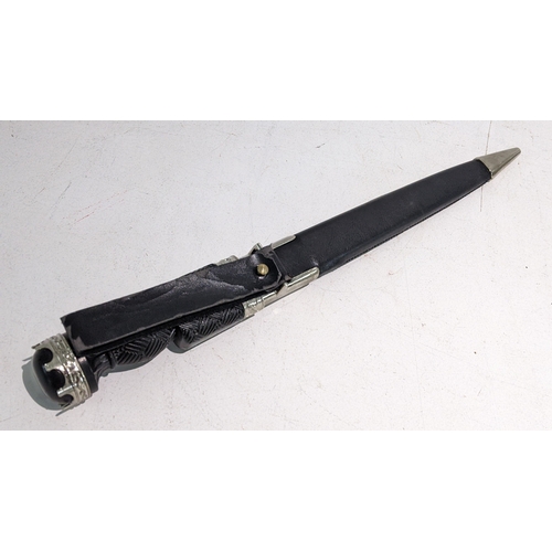 31 - A 20th Century Scottish dirk with leather scabbard
Location: RWM
If there is no condition report sho... 