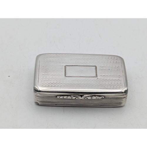 A William IV silver snuff box having engraved decoration, with central ...