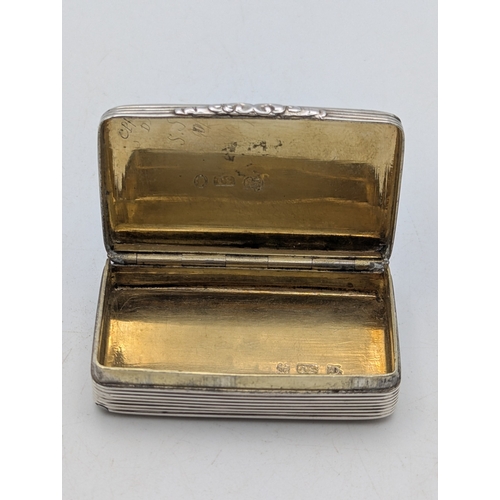 A William IV silver snuff box having engraved decoration, with central ...