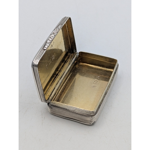 A William IV silver snuff box having engraved decoration, with central ...