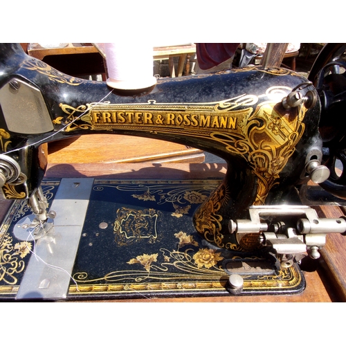 1 - Frister and Rossmann, Berlin Antique Hand crank Sewing Machine in heavy oak case, with key