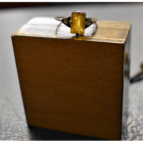 28 - Leather Stamp Case - A boxed ring, yellow and white stones, with a built in re-sizer, and a ladies s... 