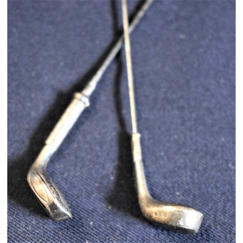 83 - A pair of silver plate golf club hat pins dated 1910-1920's