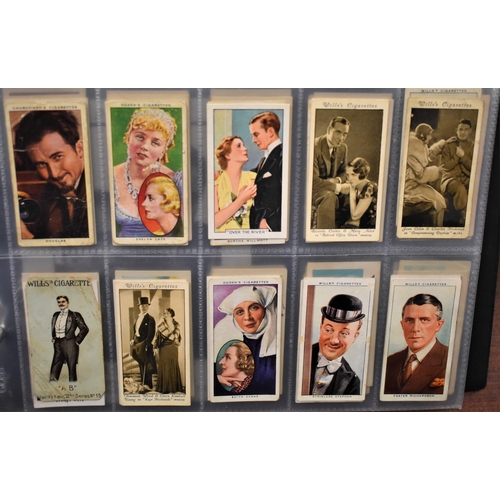 180 - Cigarette Cards. Film stars, music and singers. A collection in an album in plastics. Nice lot (100'... 