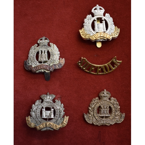 234 - Suffolk Regiment Cap Badges (4) and a Shoulder Title including, QVC type, WWI/II Cap Badge, Territor... 