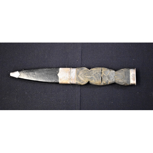 47 - Scottish Highland Dirk, a Celtic design on the handle with white-metal hilt and pommel and attachmen... 