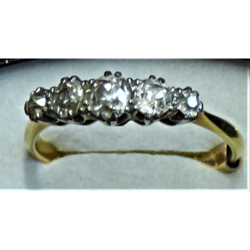 611 - An 18ct Gold Ring with five inset Diamonds circa 1910, with a 9ct fitting to help it fit better when... 