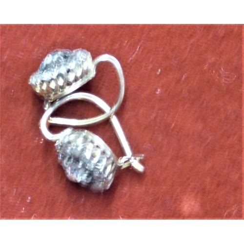 613 - A pair of Diamond earrings set in Gold, Circa 1910. Weighs 2.1gms together