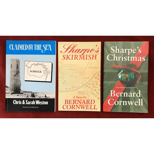 167 - Claimed by the Sea Norfolk signed by the Author Chris Weston 1994 and two books by Bernard Cornwell'... 
