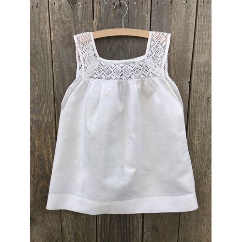 304 - Victorian linen child's pinafore with fine crochet lace yoke, open back with button fastening.