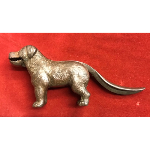 364 - 1920s dog shaped nutcracker, cast iron metal with a brass finish, made in England. Lift the tail to ... 