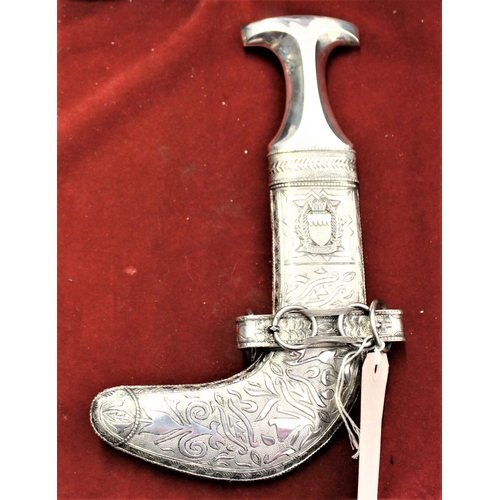 37 - Arabic Jambiya or Khanjar knife, early 20th century, with Silver handle and housed in a decorative w... 